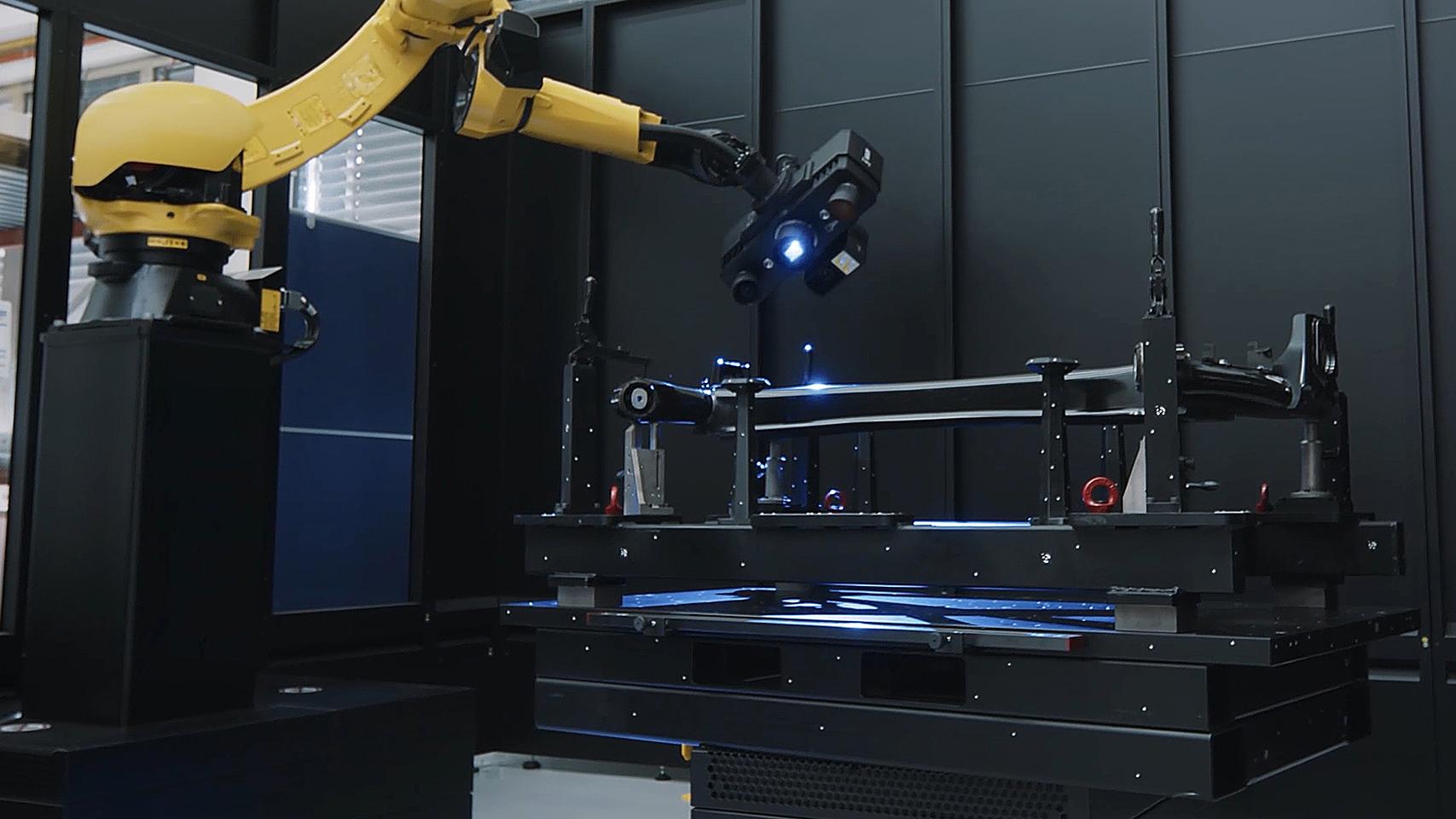 An optical sensor scans a part that is positioned on a measuring fixture.