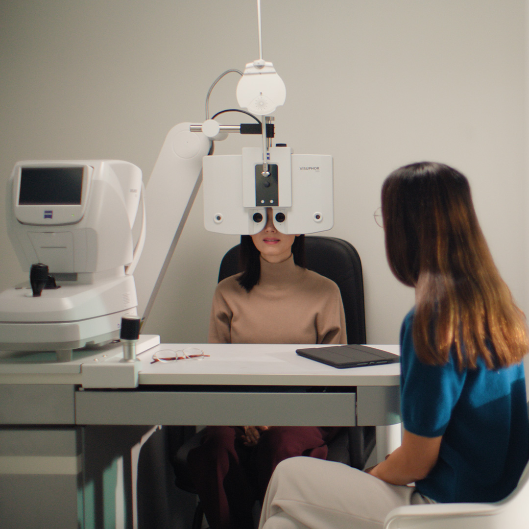 A woman getting her eyes checked.