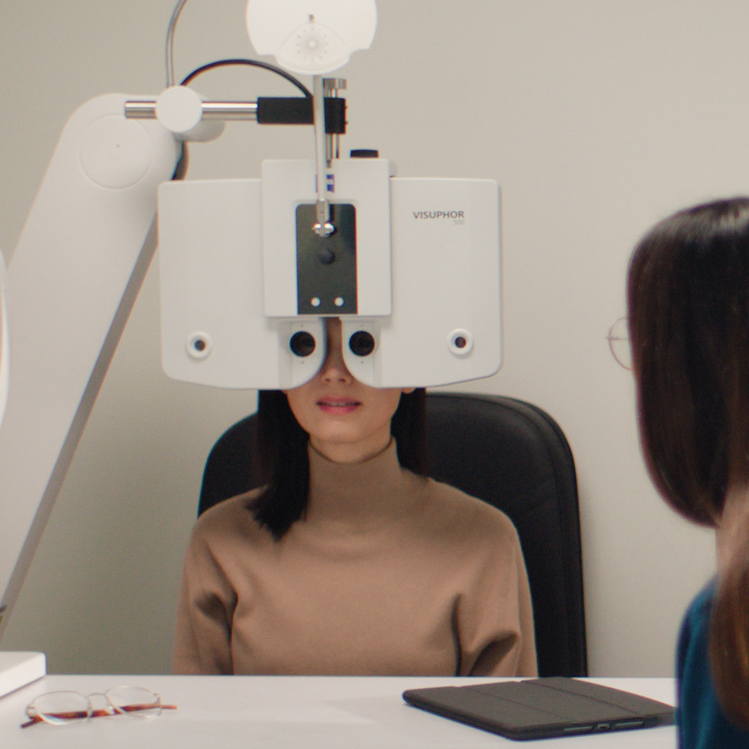 3D CGI illustration of a clear eyeglass frame with tinted lenses.