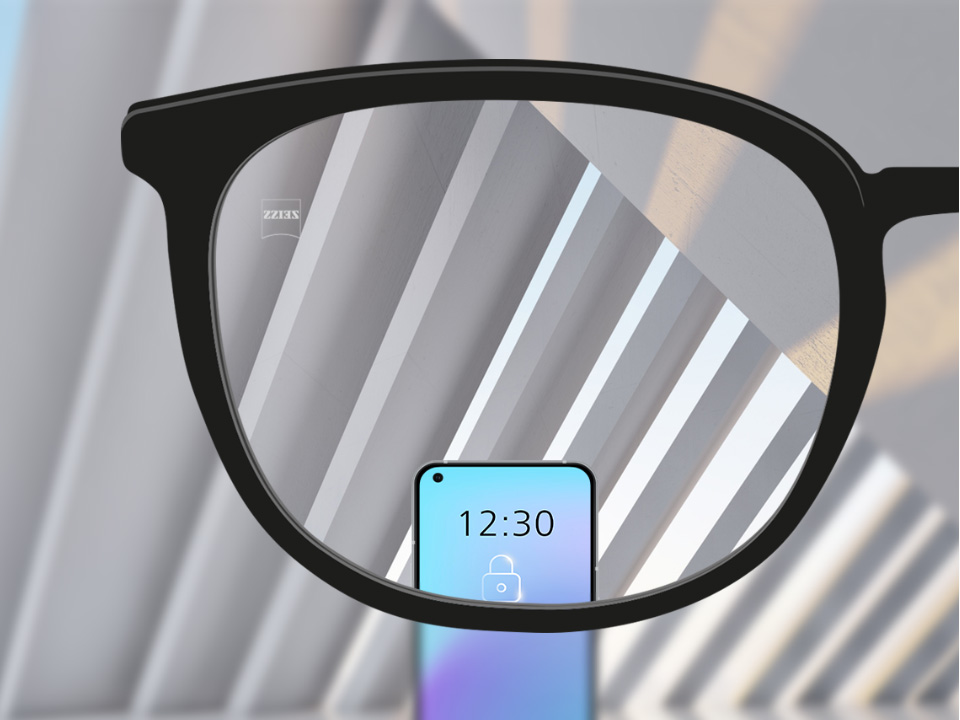 Schematic point-of-view illustration through a SmartLife single vision lens showing distant objects and a smartphone clearly with no distortion in the periphery. 