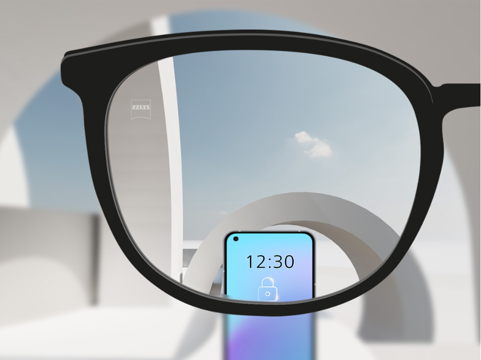 Schematic point-of-view illustration through a SmartLife Young single vision lens showing a clear view of distant objects and digital devices. 