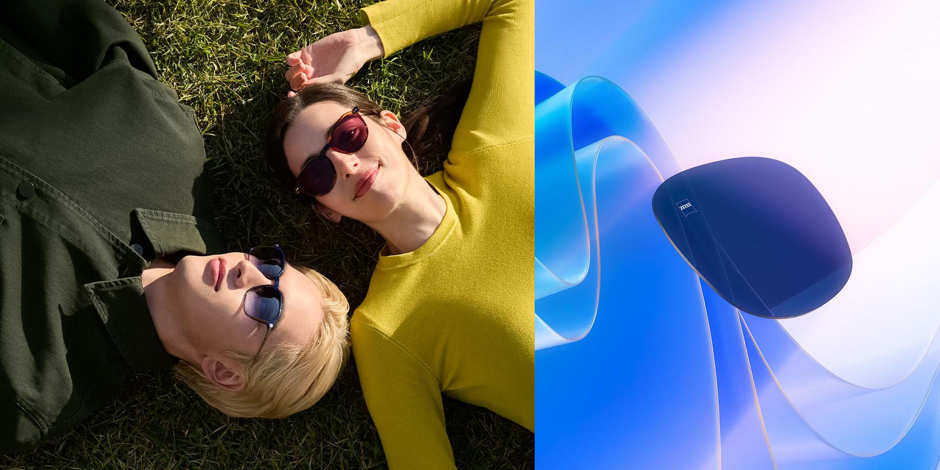 Man and woman wearing ZEISS prescription sunglasses, relaxing on the grass and gazing up at the sky. A CGI representation of a tinted lens is shown floating towards sunlight, illustrating its UV ray-blocking capabilities